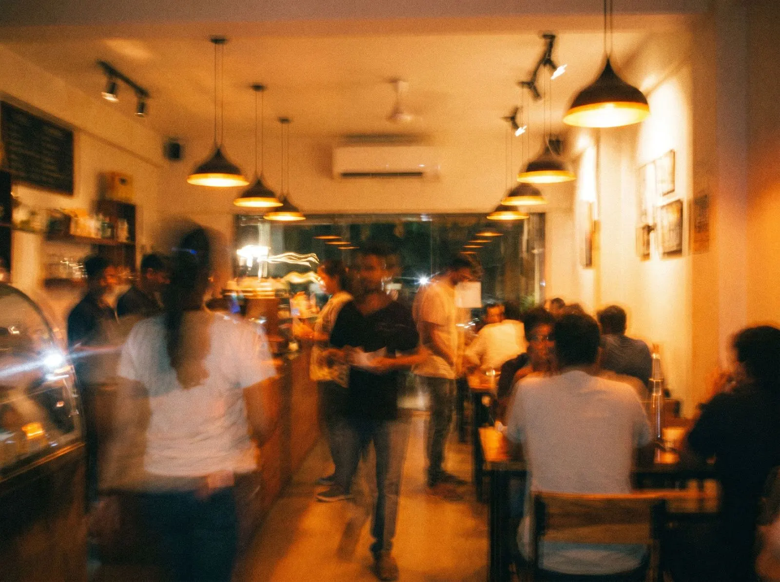 Motion-blurred crowd in a bar